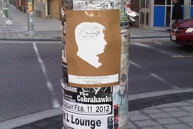 artery poster art show poster on street post filled with posters