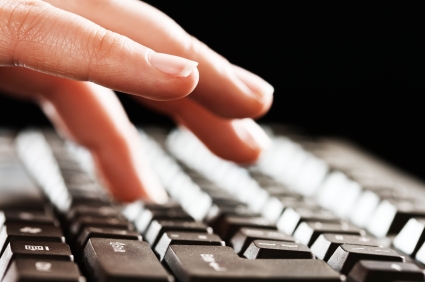 hands typing blog post